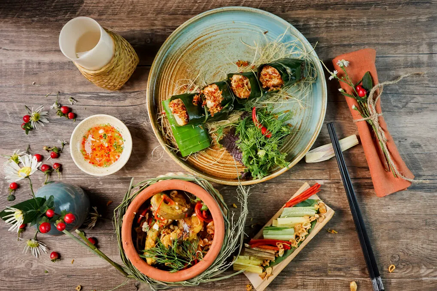 vietnamese food spread on a wooden tables