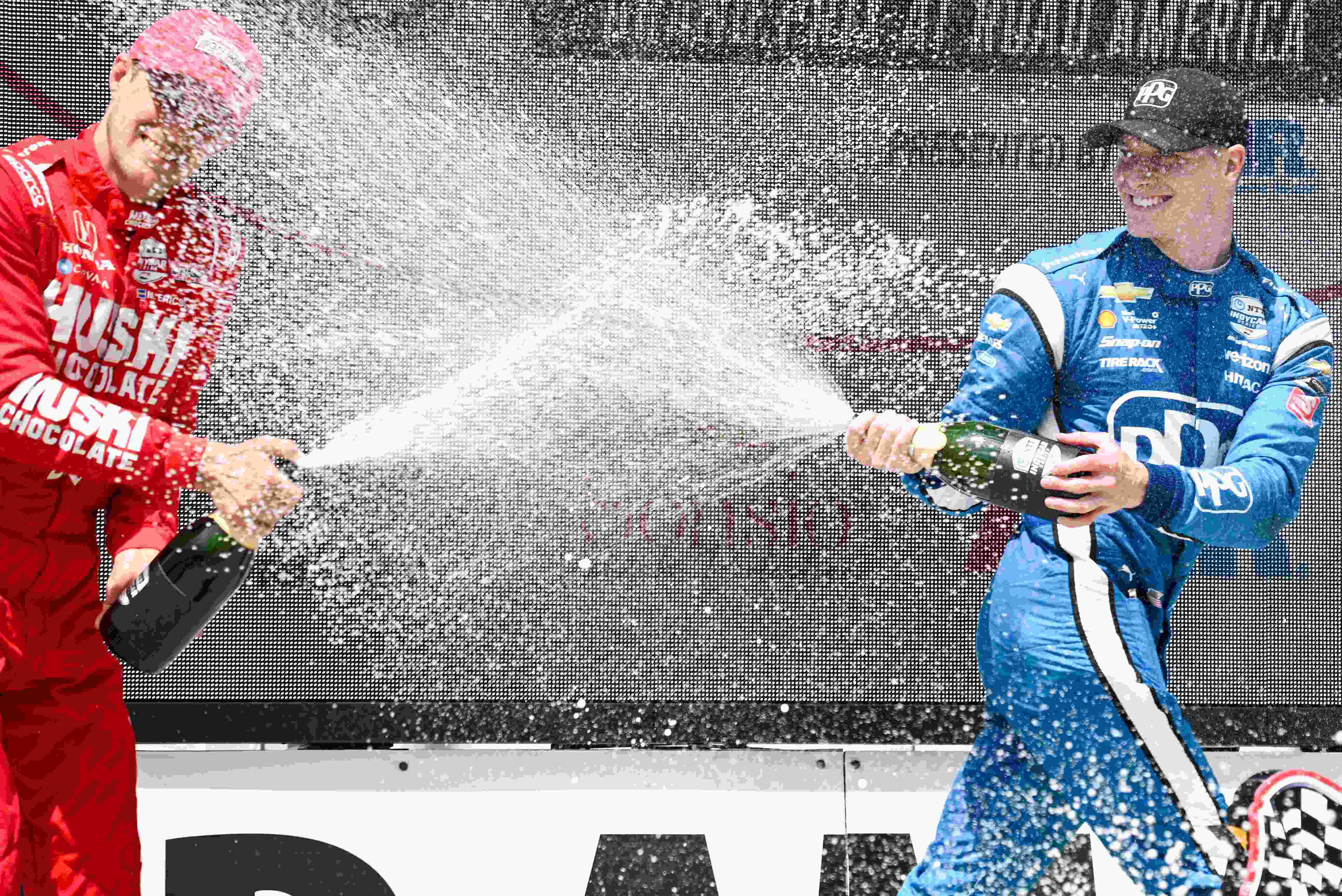 Marcus Ericsson and Josef Newgarden share the winners' podium.