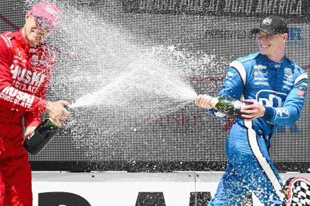 Marcus Ericsson and Josef Newgarden share the winners' podium.