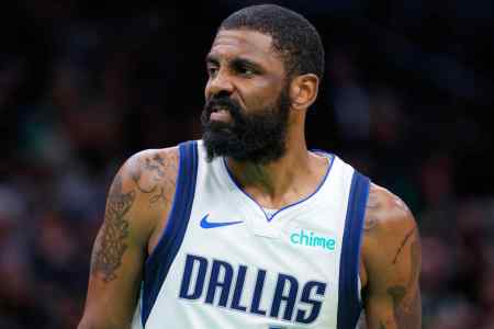Dallas Mavericks guard Kyrie Irving makes a face.