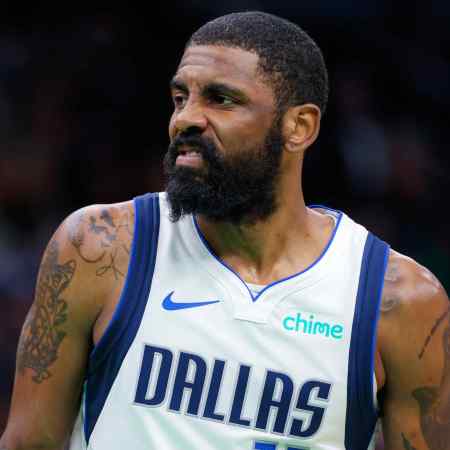 Dallas Mavericks guard Kyrie Irving makes a face.