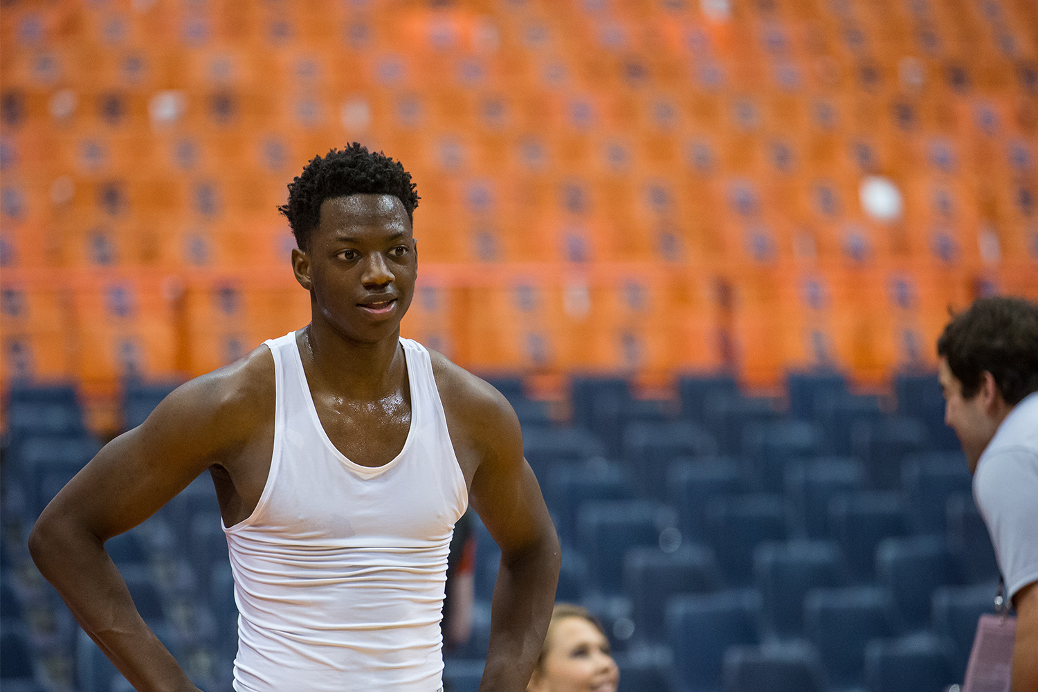 Kaleb Joseph standing in a basketball arena before a game.