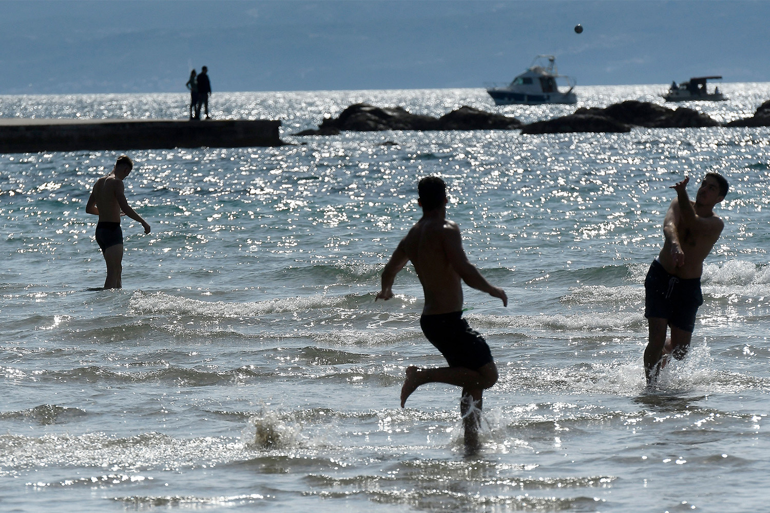An angle of Croatian locals playing picigin during the summer.
