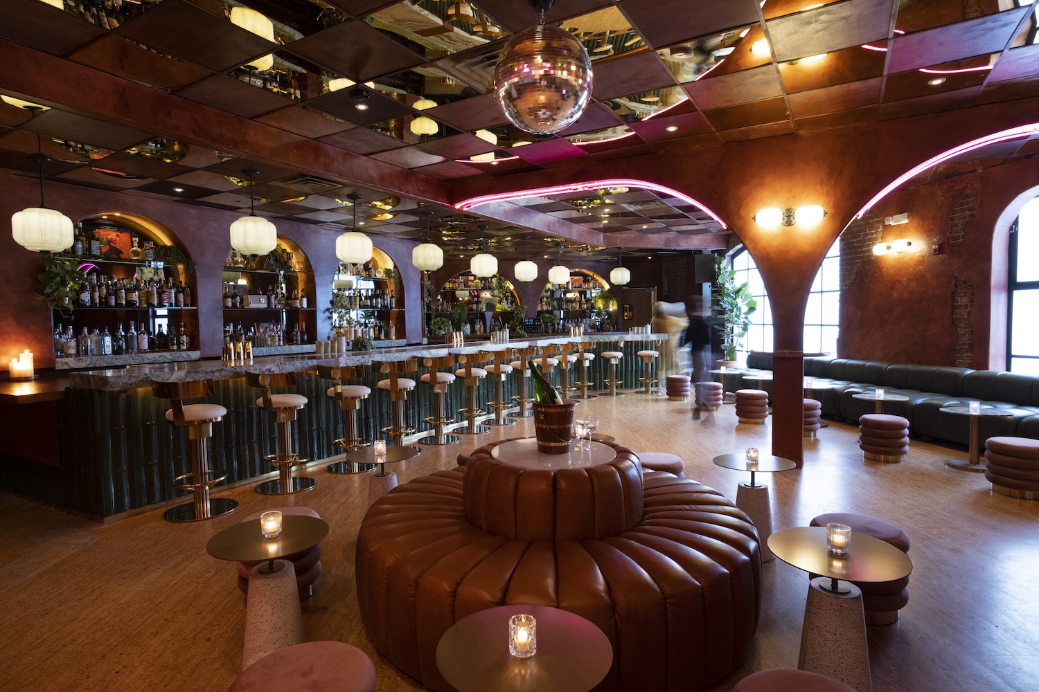 The Let's Go's floral-decorated bar space and integrated dance floor