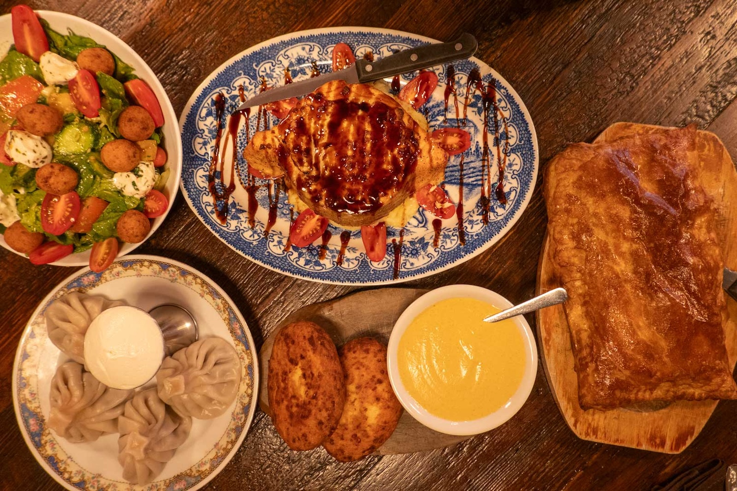 Oda House introduced Georgian food to Manhattan a decade ago. The House Special is a baked salmon dish heavy on sour cream and cheese and with a balsamic drizzle.