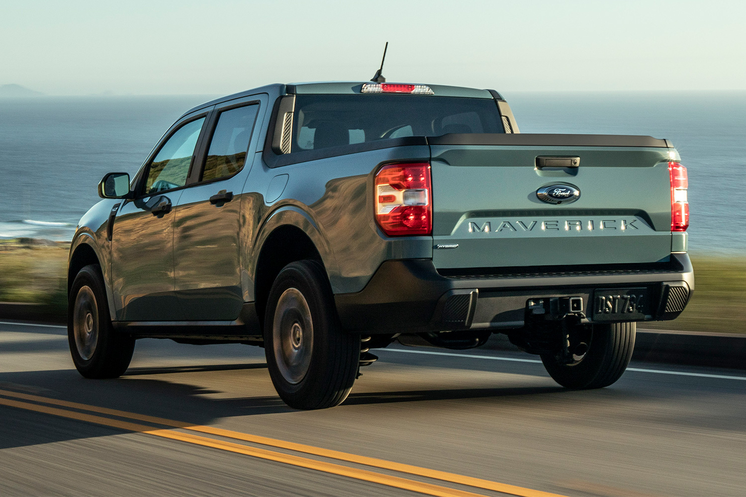 A Ford Maverick pickup truck driving down the road