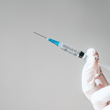 Doctor with needle