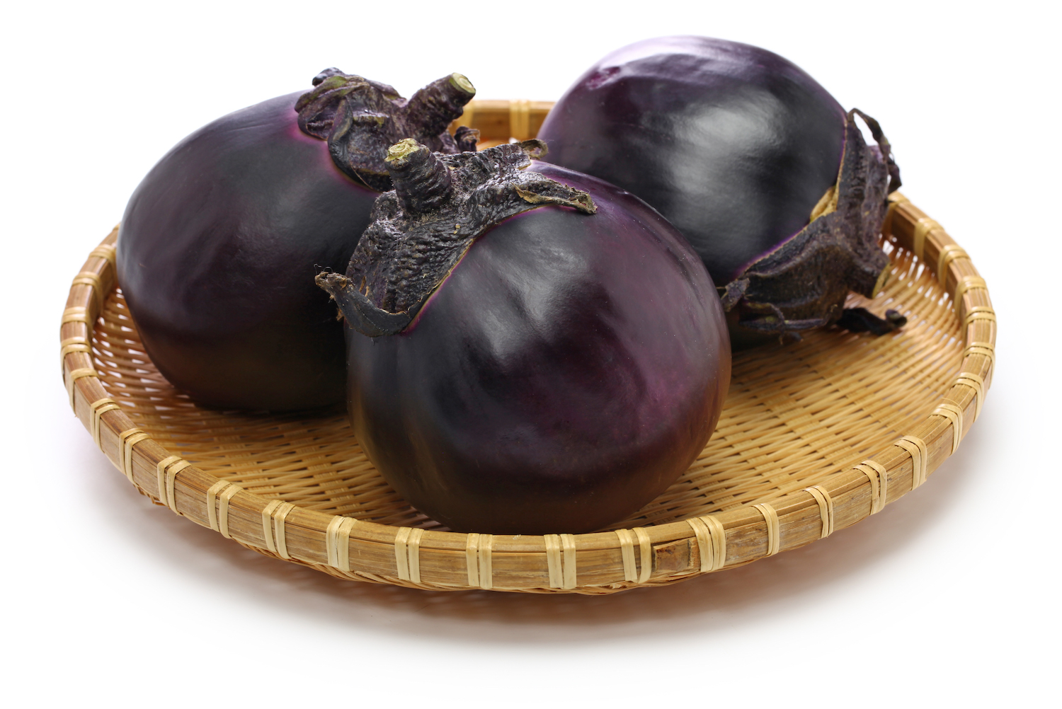Kamo nasu, japanese eggplant made in Kyoto, isolated in a basket on white background