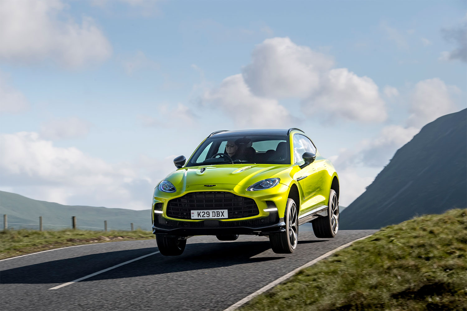 2025 Aston Martin DBX707 SUV driving at high speeds in Scotland