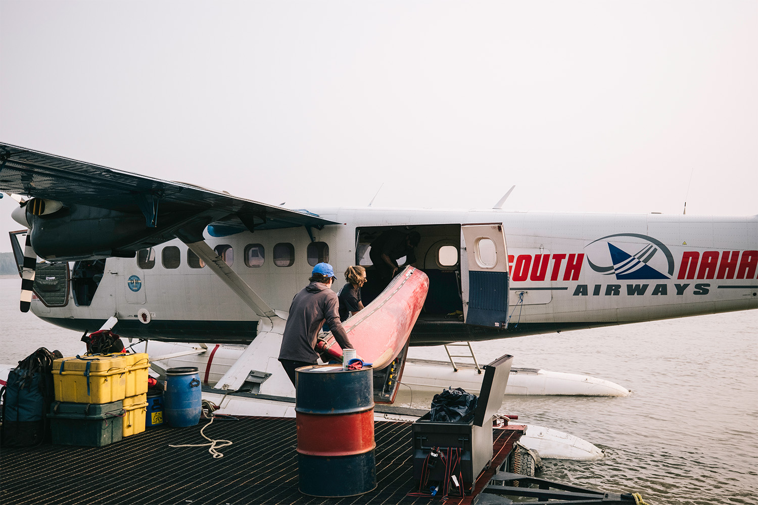 They load the seaplane up with equipment.