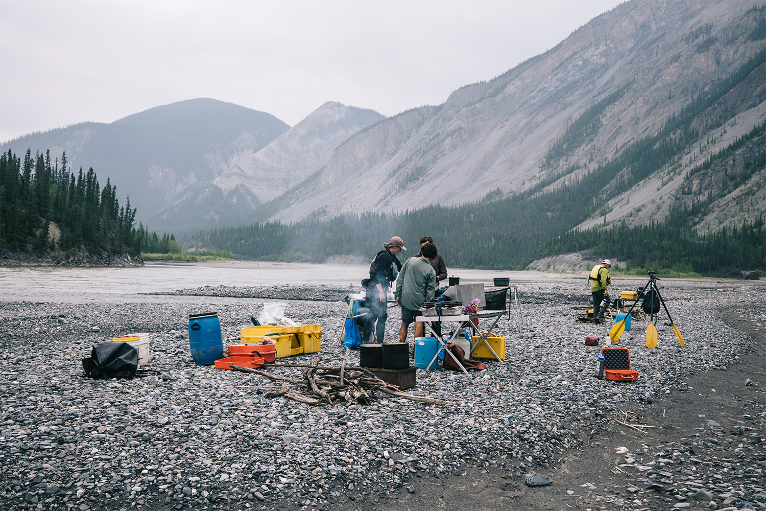 Cooking lunch on the riverbank.