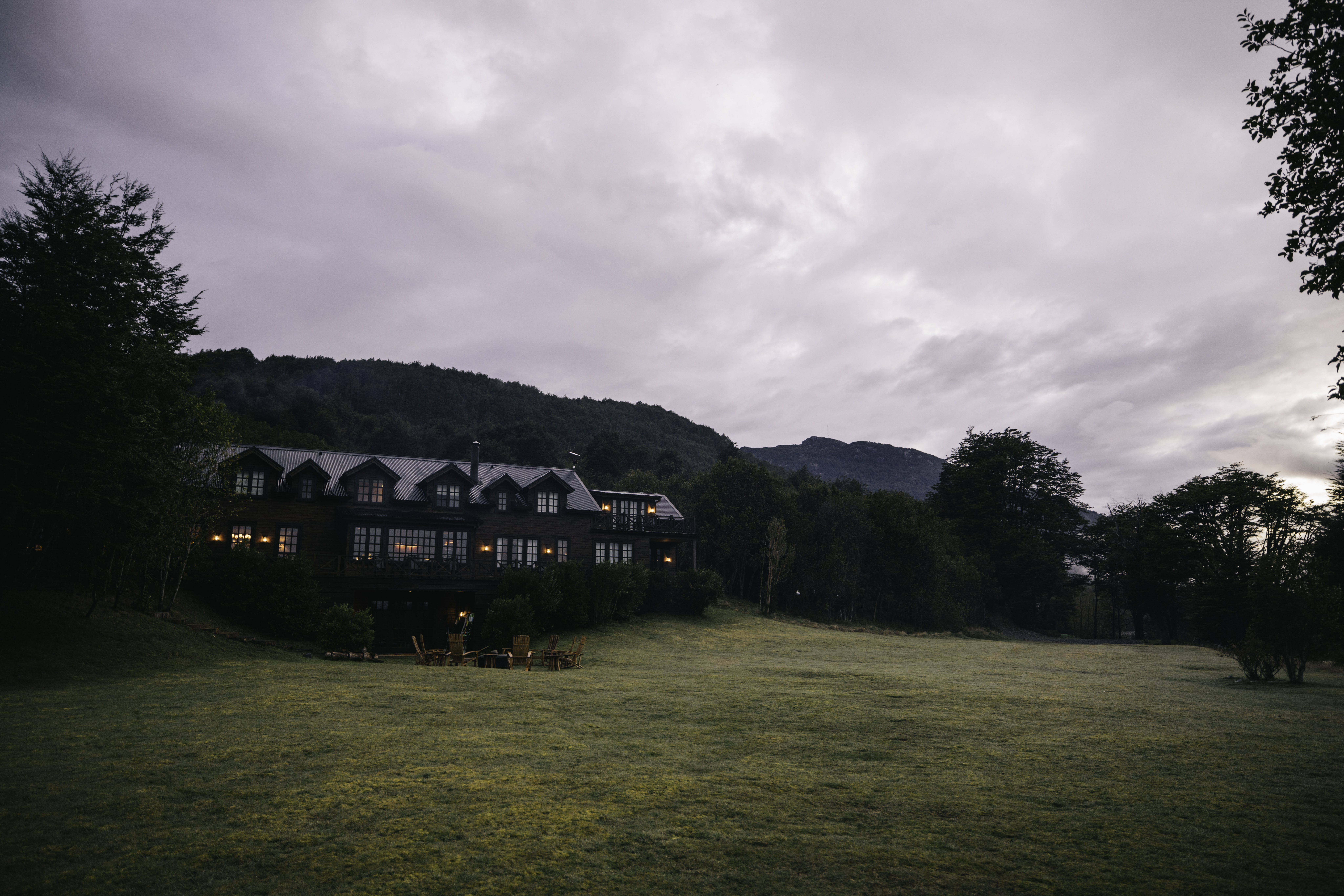 A view of the Rio Palena Lodge against a dusk sky.