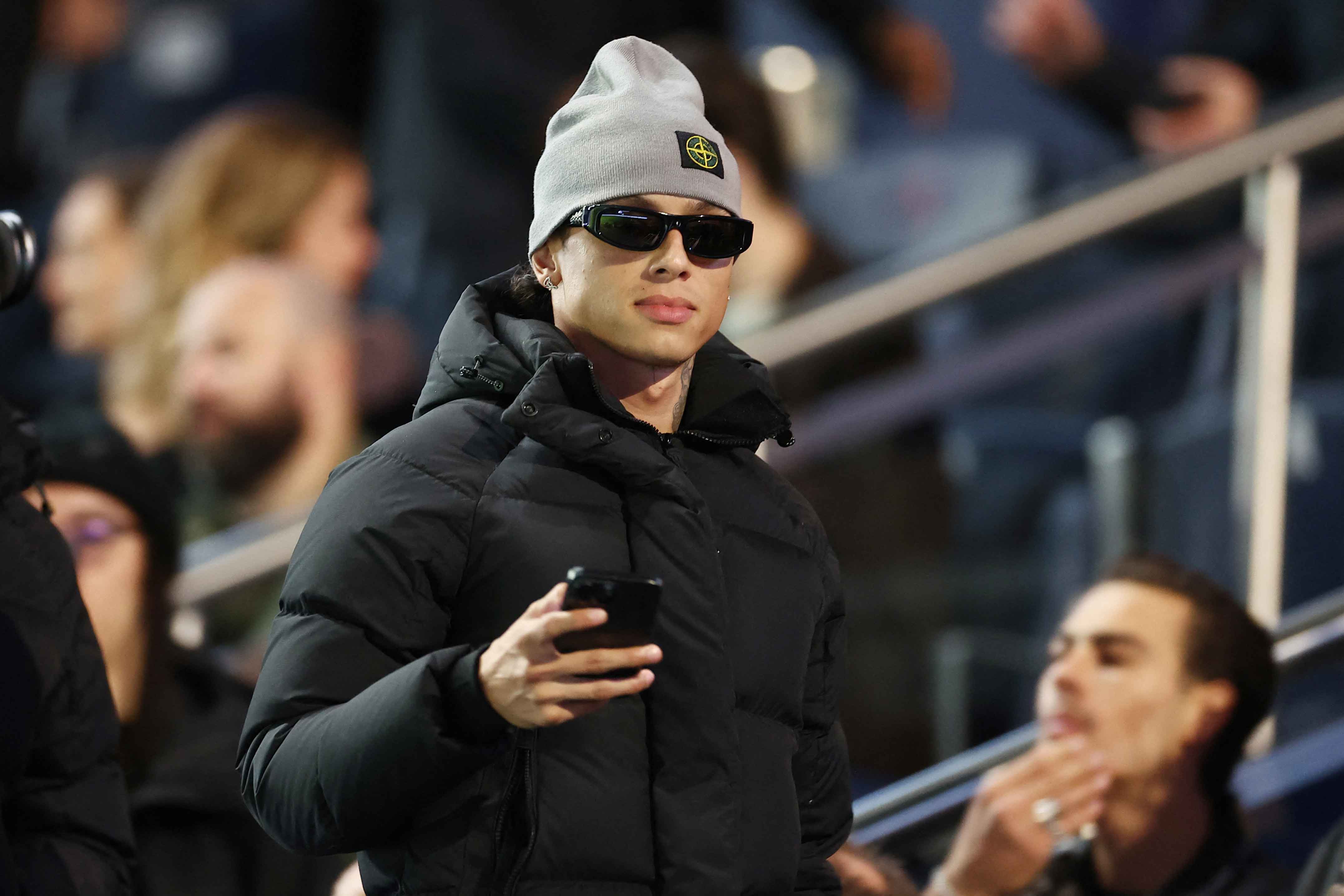 British rapper and songwriter Central Cee looks on prior to the start of the French L1 football match between Paris Saint-Germain (PSG) and Stade Rennais FC at The Parc des Princes Stadium in Paris on September 27, 2024. (Photo by FRANCK FIFE / AFP) (Photo by FRANCK FIFE/AFP via Getty Images)