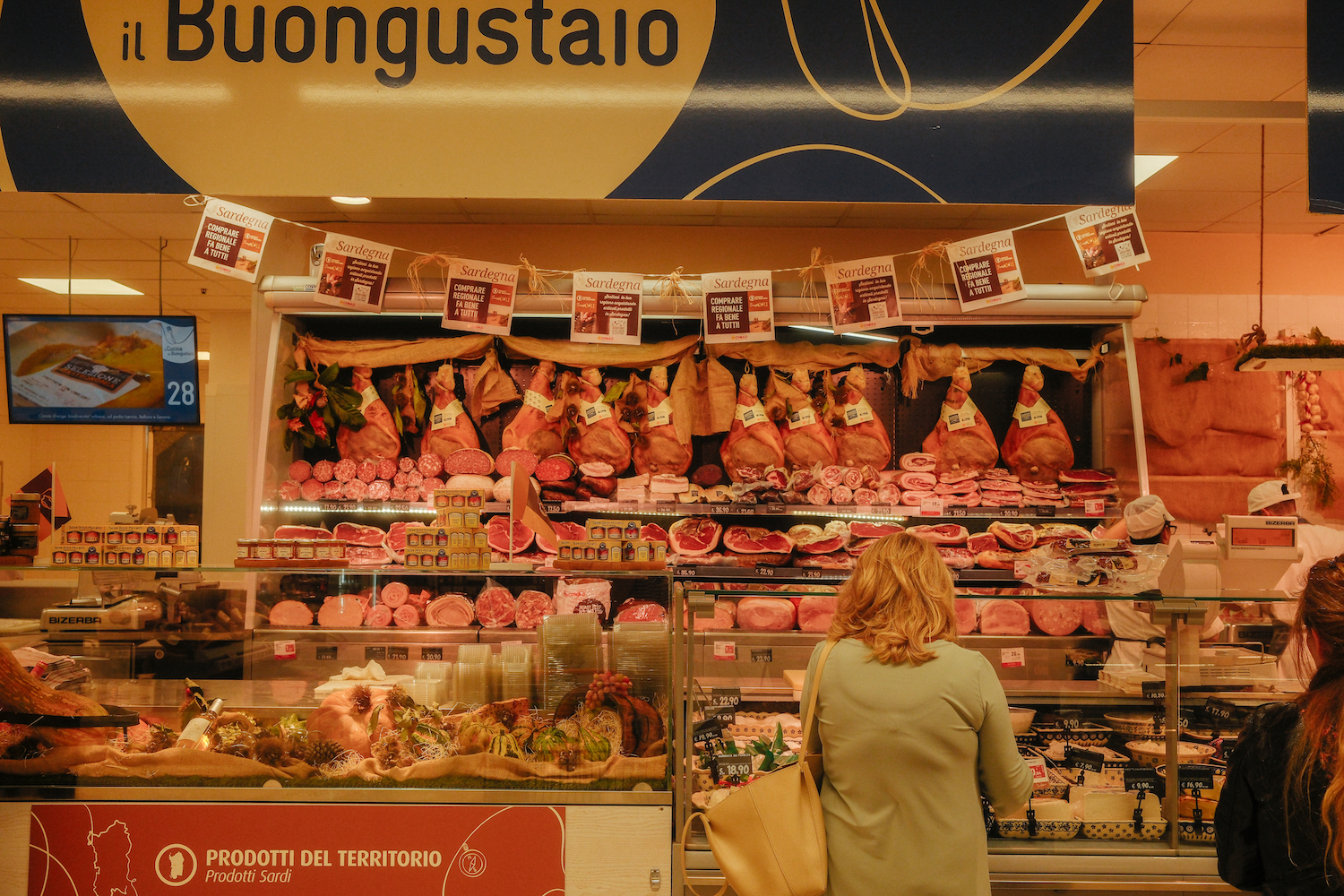 a meat counter in an italian grocery store