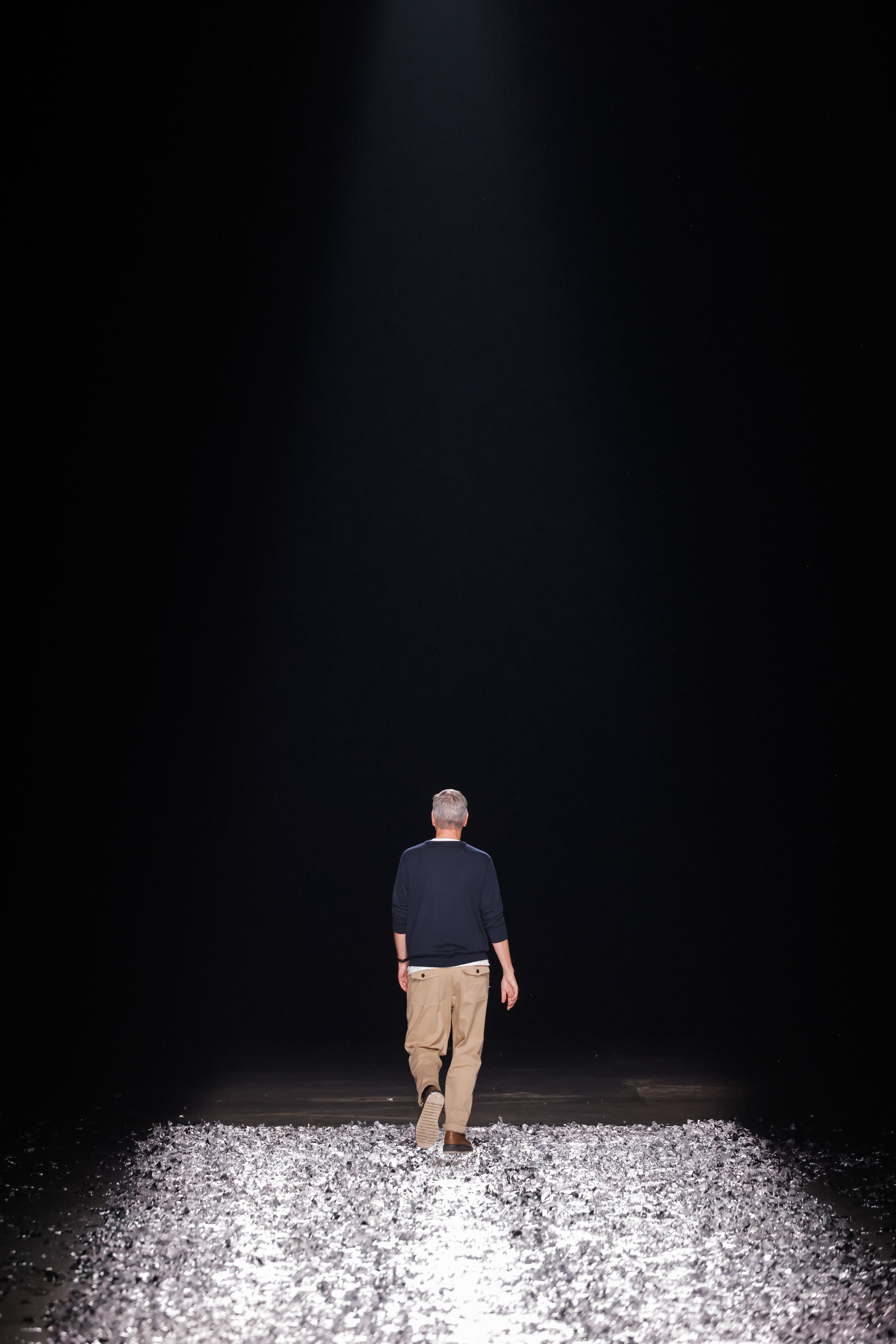 PARIS, FRANCE - JUNE 22: Designer Dries Van Noten acknowledges the audience after the Dries Van Noten Menswear Spring/Summer 2025 show at the Babcock factory in La Courneuve as part of Paris Fashion Week on June 22, 2024 in Paris, France. (Photo by Richard Bord/Getty Images)