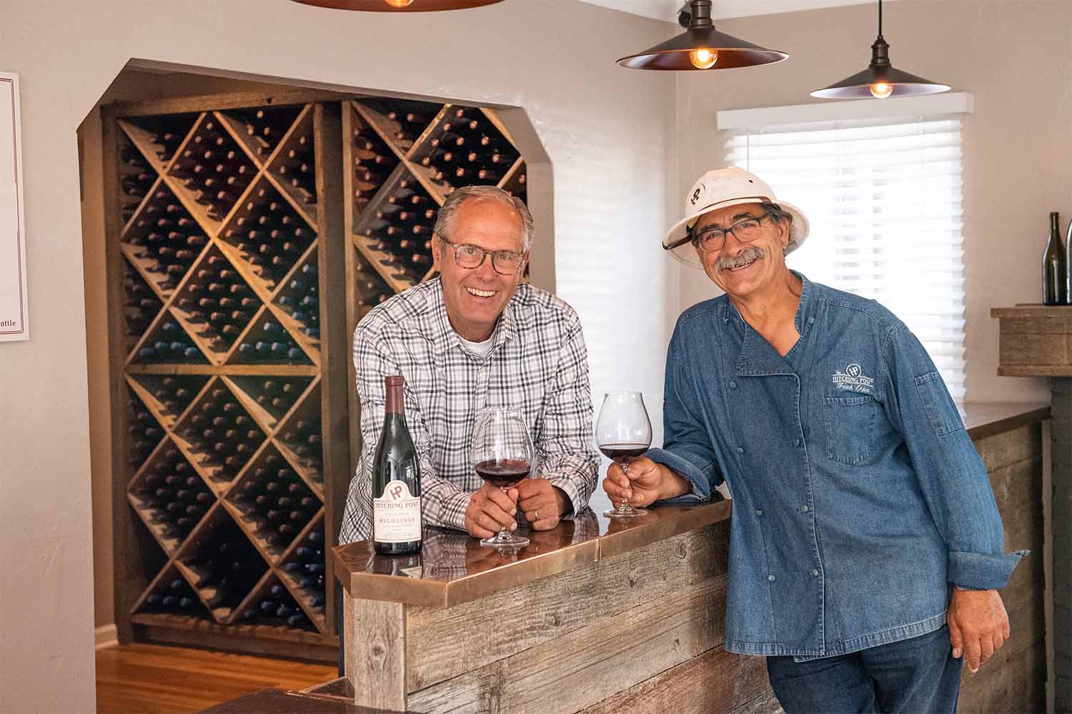 Gray Hartley and Frank Ostini (also owner and chef of the Hitching Post 2) with the 20th Anniversary Highliner Pinot Noir