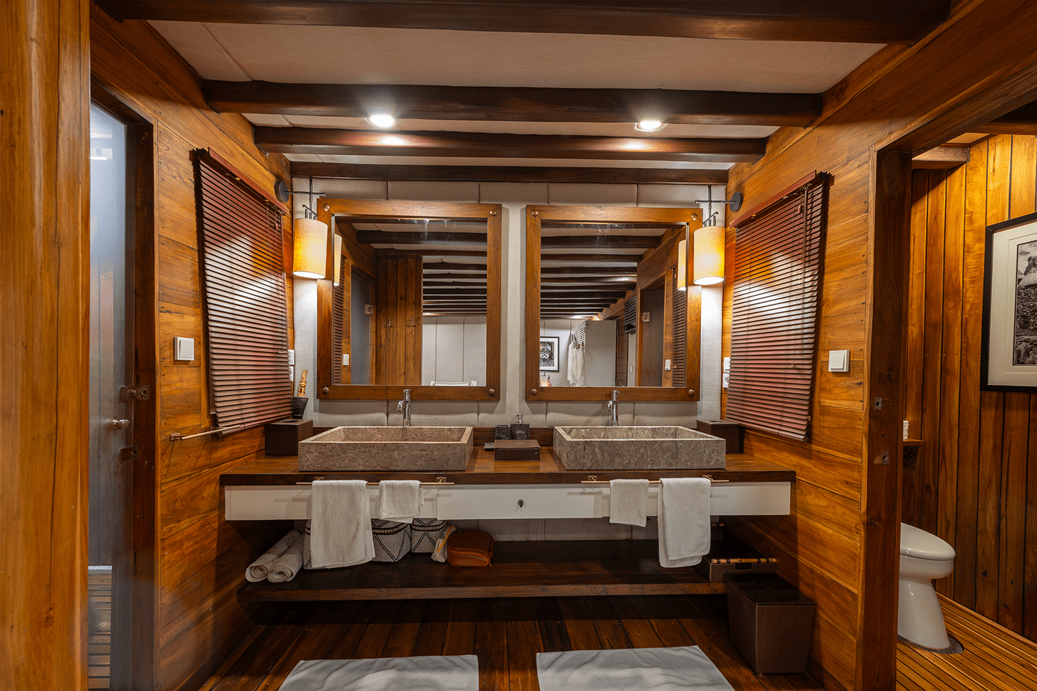 Twin marble sinks and Balinese cosmetics feature in roomy ensuite bathrooms