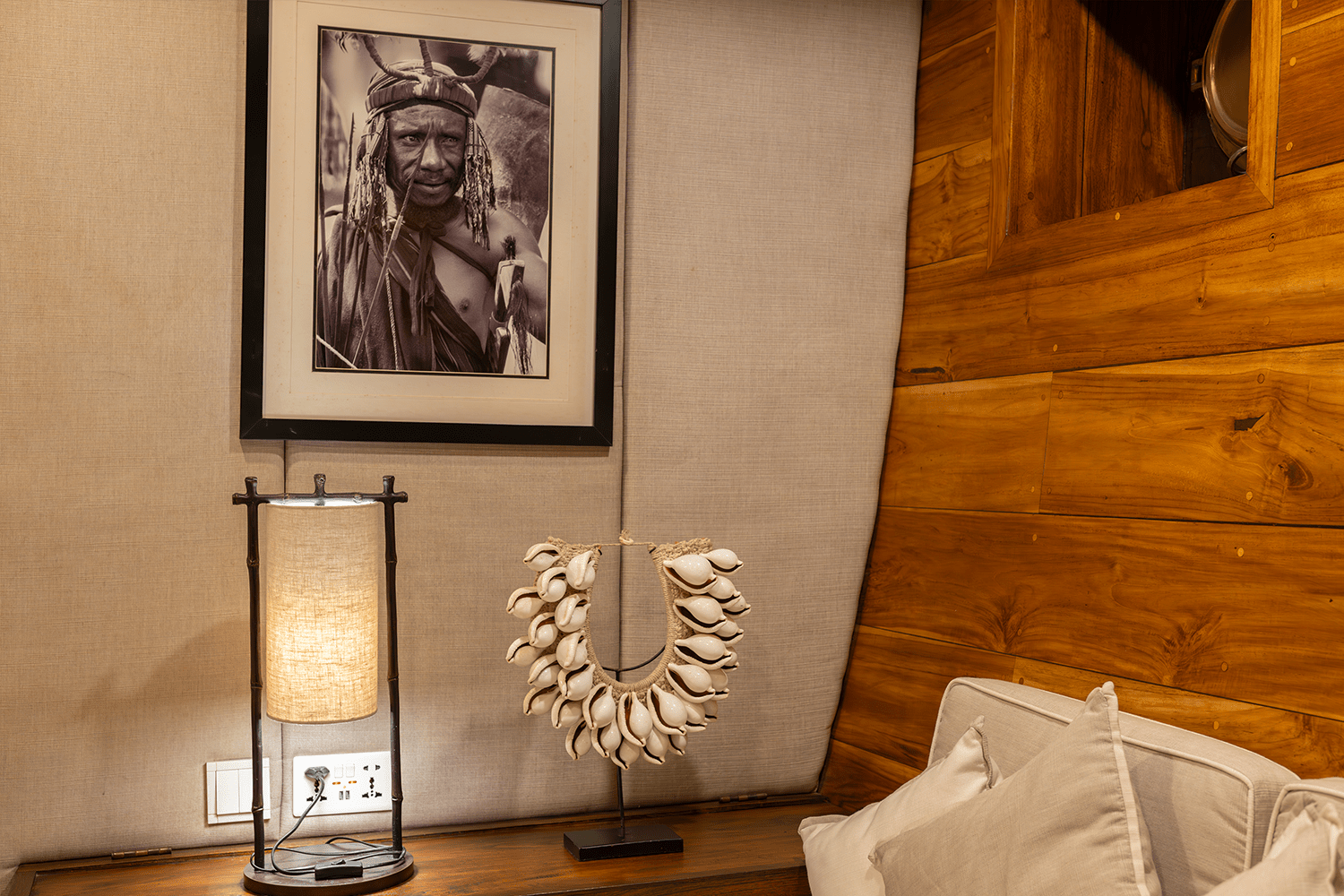 A cowrie shell necklace and a black-and-white image of an Asmat tribe member, from Indonesia’s easternmost province Papua, adorn the Komodo suite.