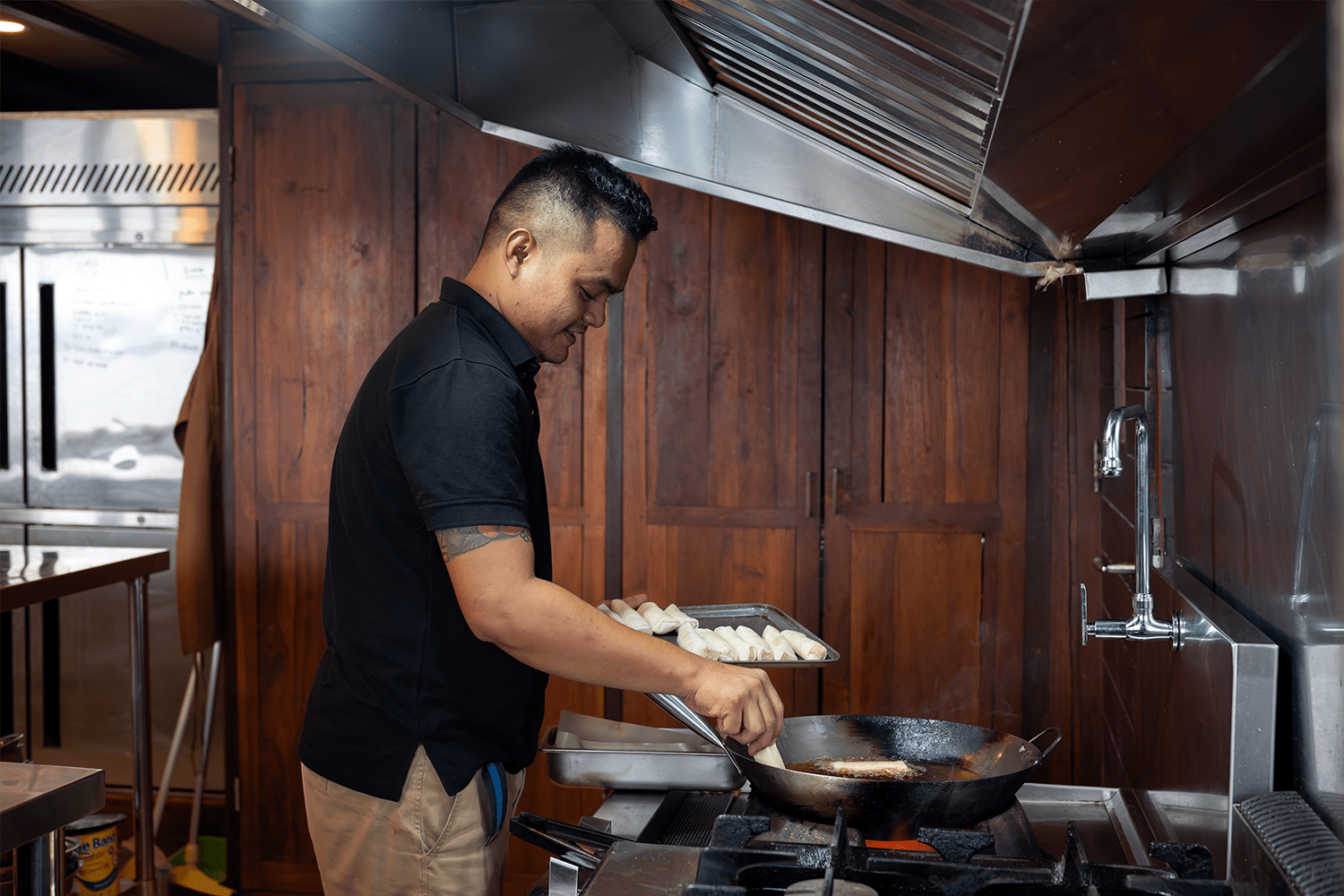 Chef Teguh cooks up a storm, including Indonesian specialties like mie goreng, with a smile in his tiny galley