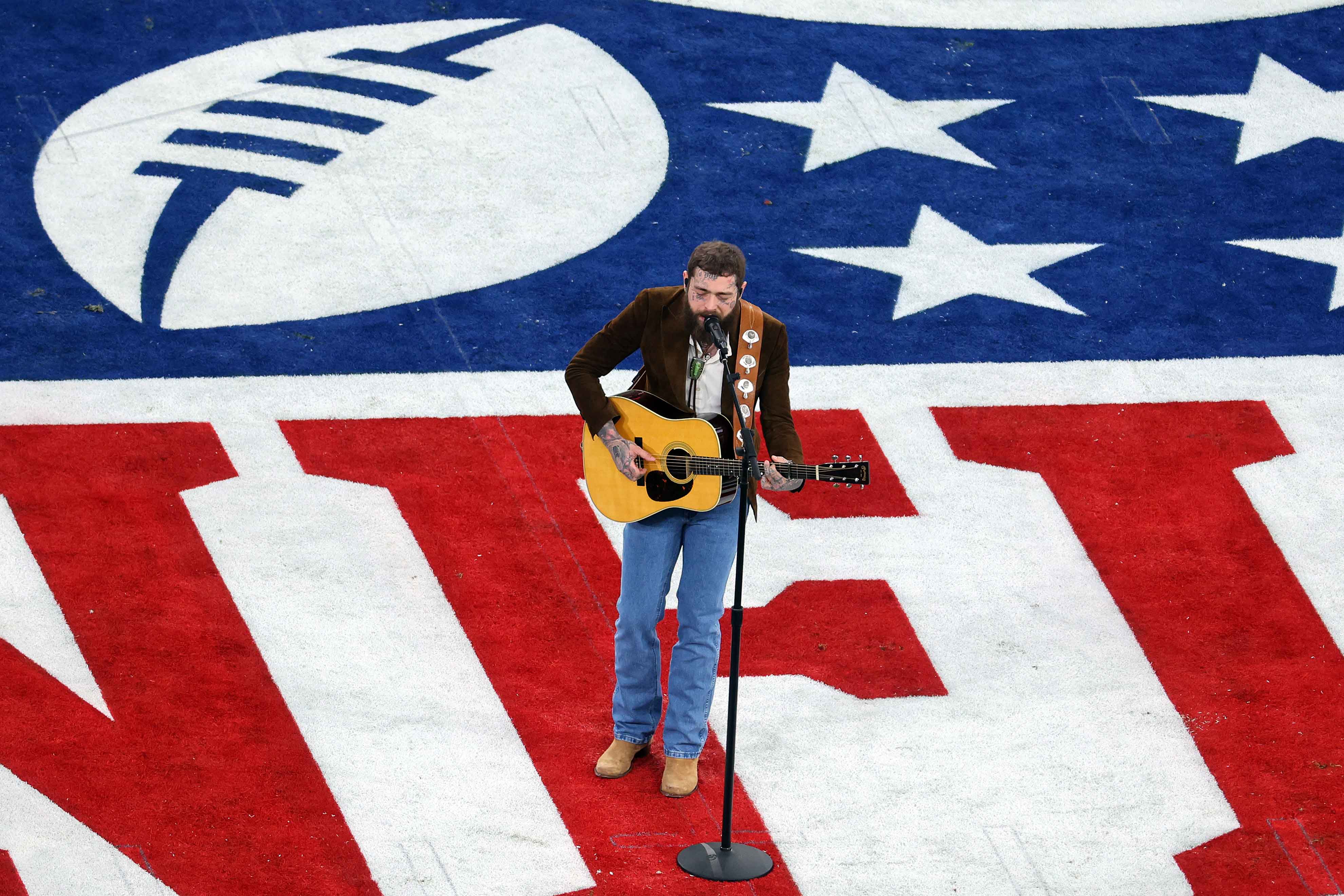 LAS VEGAS, NEVADA - FEBRUARY 11: American rapper and singer Post Malone performs prior to Super Bowl LVIII between the San Francisco 49ers and Kansas City Chiefs at Allegiant Stadium on February 11, 2024 in Las Vegas, Nevada. (Photo by Michael Reaves/Getty Images)