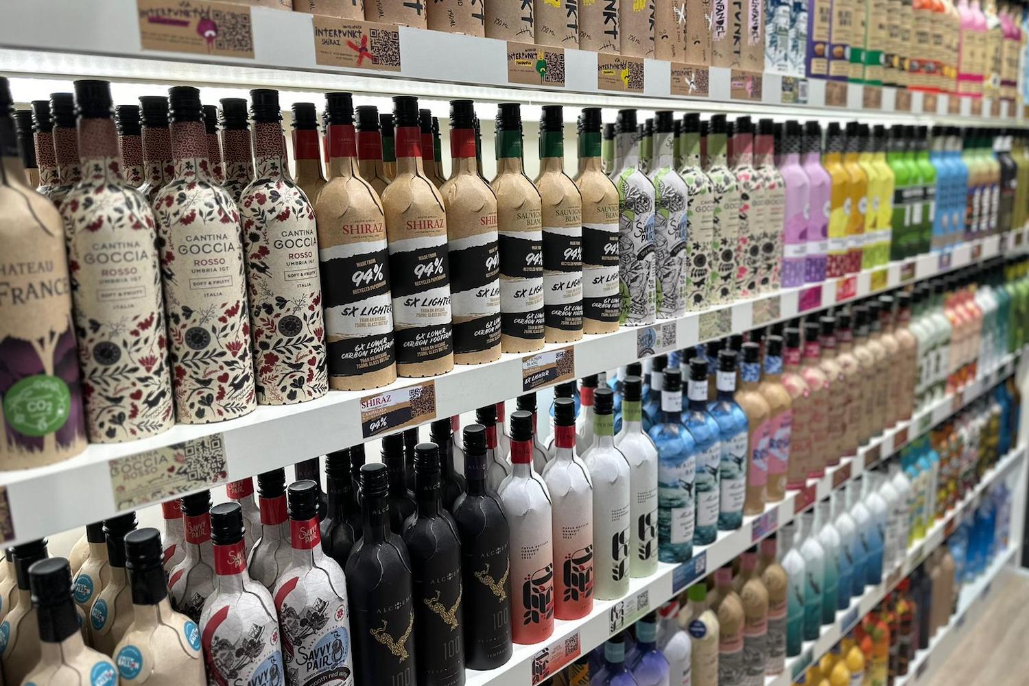 Frugalpac bottles line the shelves at ProWein, a wine and spirits trade show