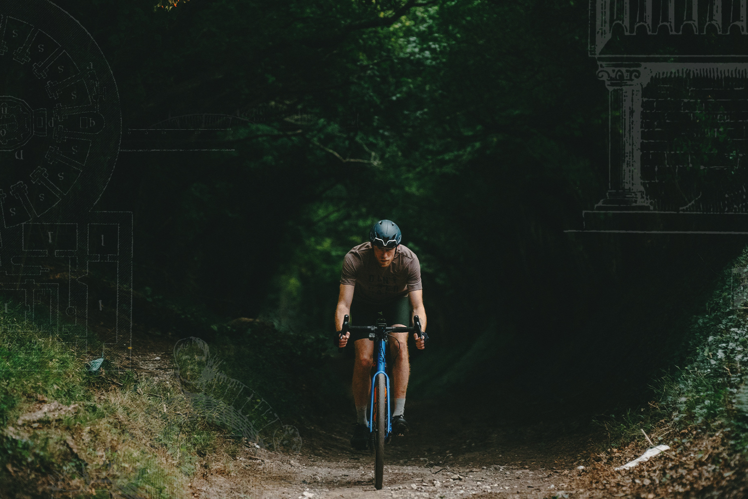 Guy Stapleford emerges from from the trees on a shady trail. Sketches of Roman columns in the corners of the photo.