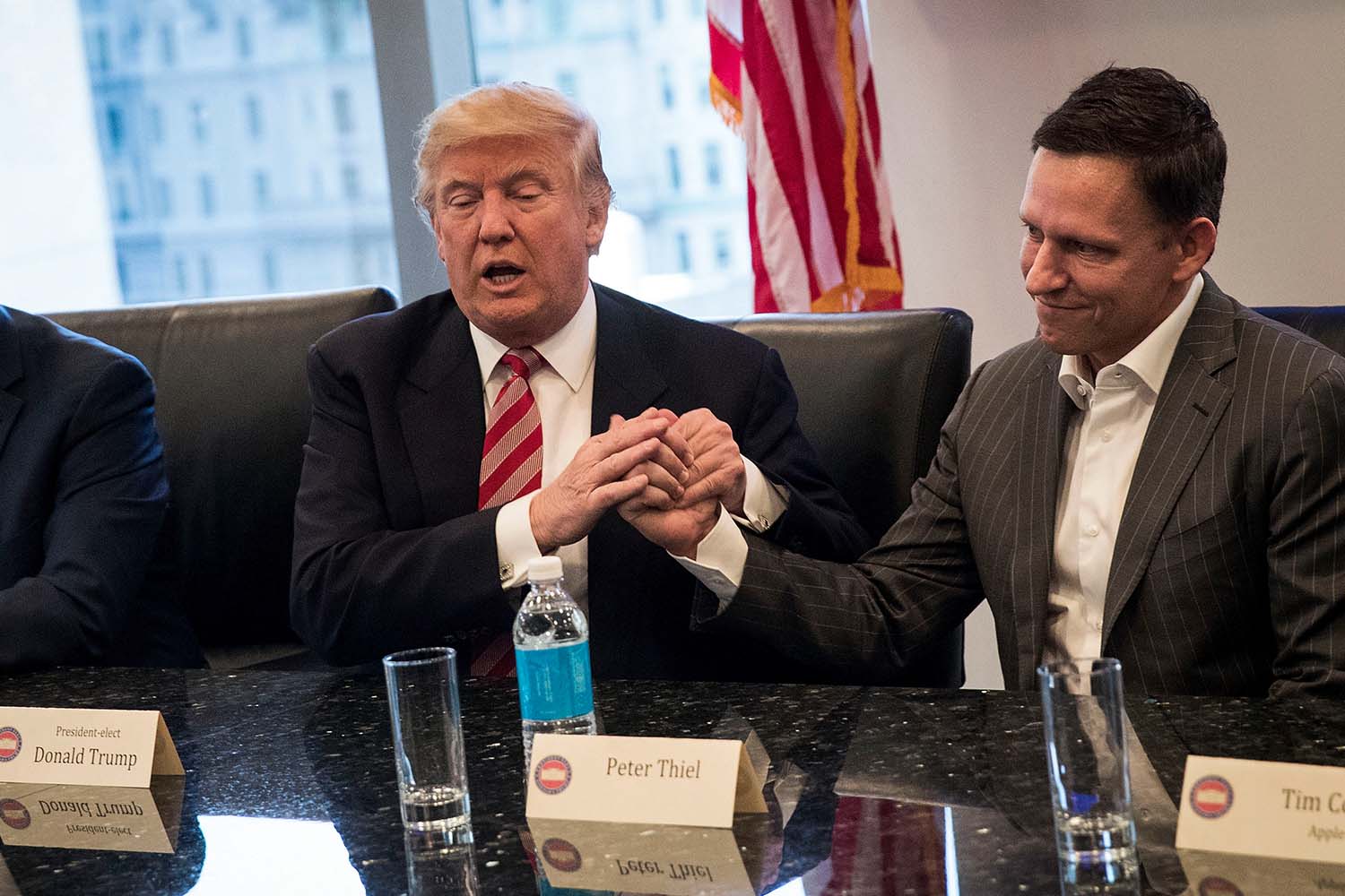 President-elect Donald Trump shakes the hand of Peter Thiel during a meeting with technology executives at Trump Tower, December 14, 2016 in New York City.
