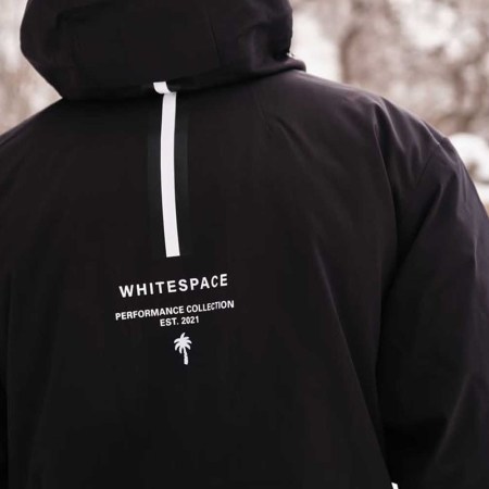A man wearing a Whitespace ski jacket.