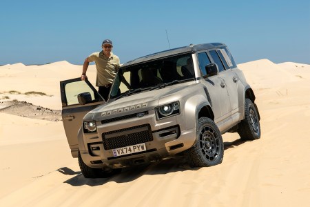 InsideHook correspondent Basem Wasef standing next to the new Land Rover Defender OCTA
