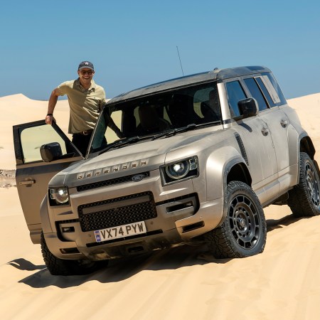 InsideHook correspondent Basem Wasef standing next to the new Land Rover Defender OCTA