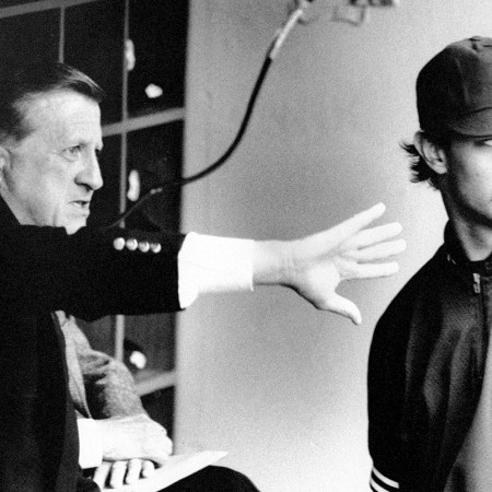 George Steinbrenner gestures to Don Mattingly in the Yankee dugout.