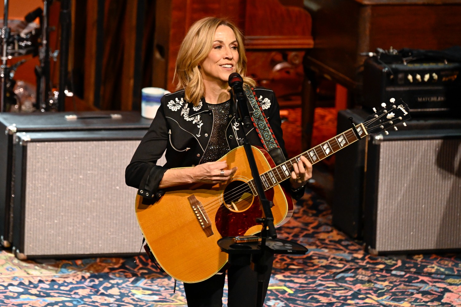 Sheryl Crow performing on stage