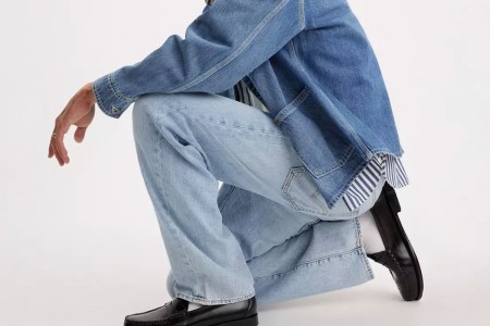 A man wearing Levi's jeans and a denim jacket