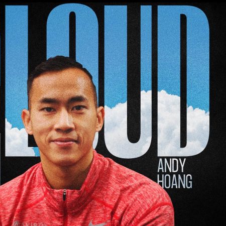 Andy Hoang, CEO of Aviron, in a red zip-up with “Cloud 9” text behind him and a backdrop of bright blue sky and clouds
