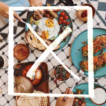 a picture of brunch on a black and white table with a white x over it