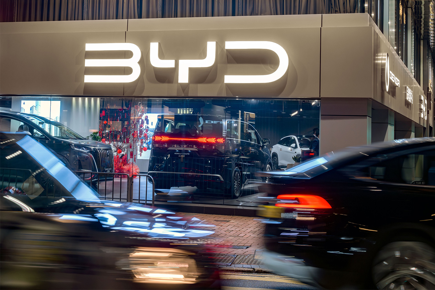 A BYD showroom filled with cars in Hong Kong. The automaker hit another EV milestone: charging as fast as filling up a gas car.