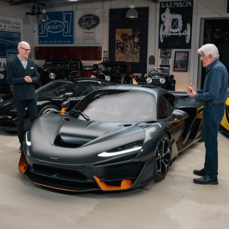 Jay Leno and McLaren Automotive CEO Michael Leiters stand next to the McLaren W1, a new supercar that Leno is buying