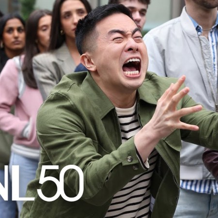 Bowen Yang waiting on line in an "SNL" sketch