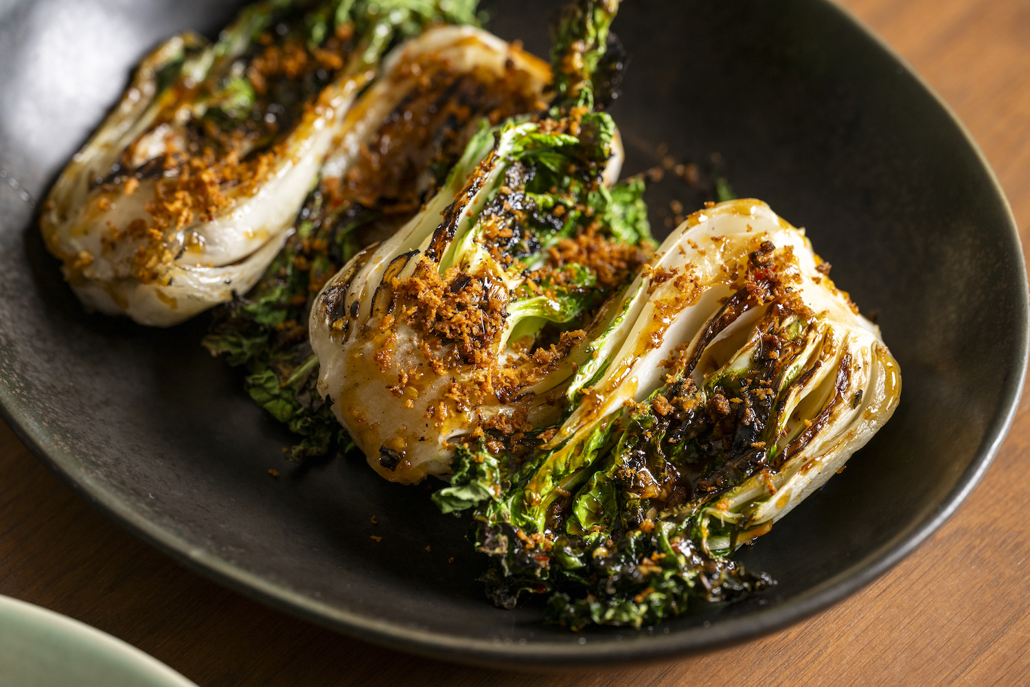 The charcoal-grilled bok choy with anchovy oyster sauce from Bangkok Supper Club