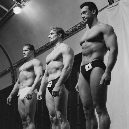 Egyptian bodybuilder Antoine Boulos, British bodybuilder Reuben Martin, and South African bodybuilder Jannie Graaff, competitors during the pre-judging for the Mr Universe contest, at the Royal Hotel in Woburn Place in the Bloomsburt district of London, England, 16th September 1960.