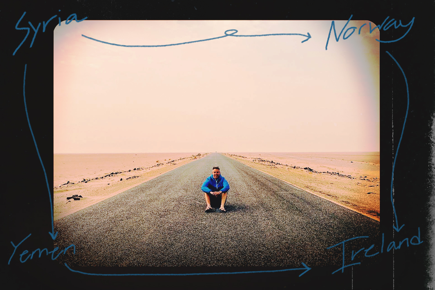 Johnny Ward sitting in the middle of a road in the middle of a desert