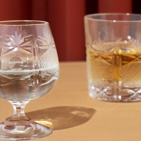 A water glass and a whiskey glass