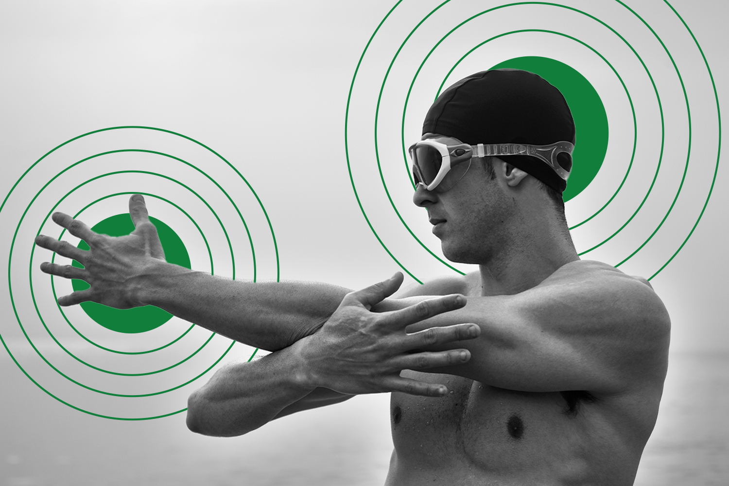 Male swimmer in cap and goggles stretching his shoulder before a swim, with graphic target overlays in background