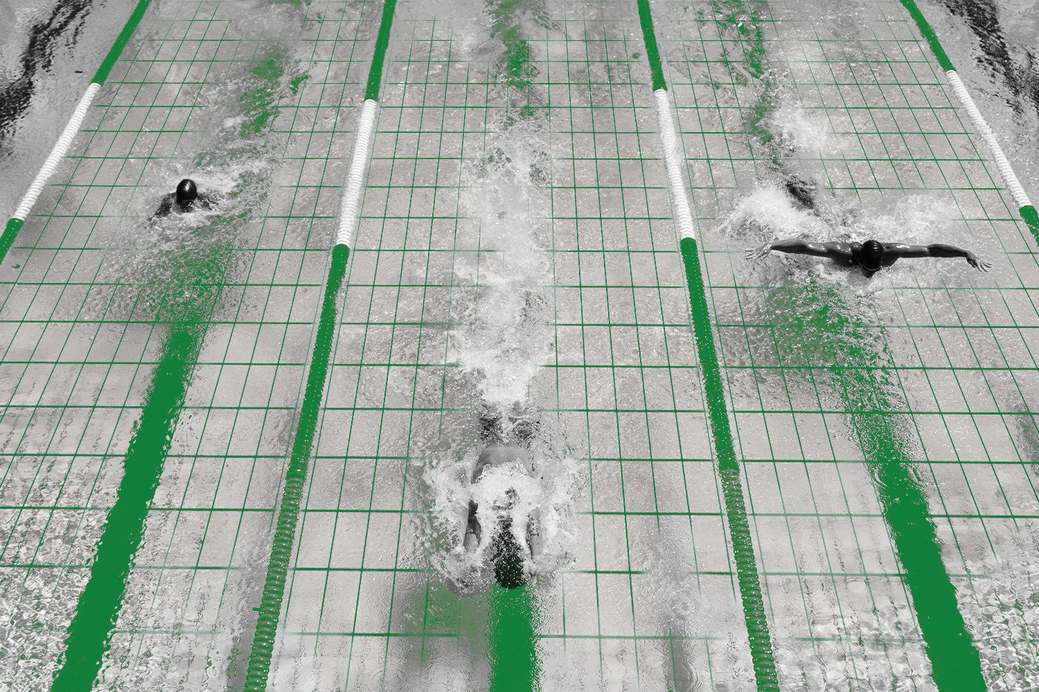 Overhead view of three swimmers in separate lanes using different strokes in a lap pool