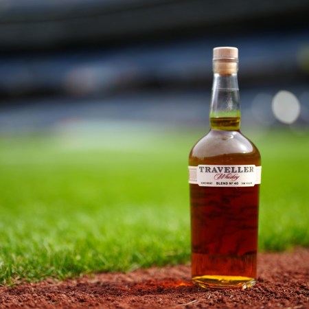 Traveller Whiskey bottle on a baseball field