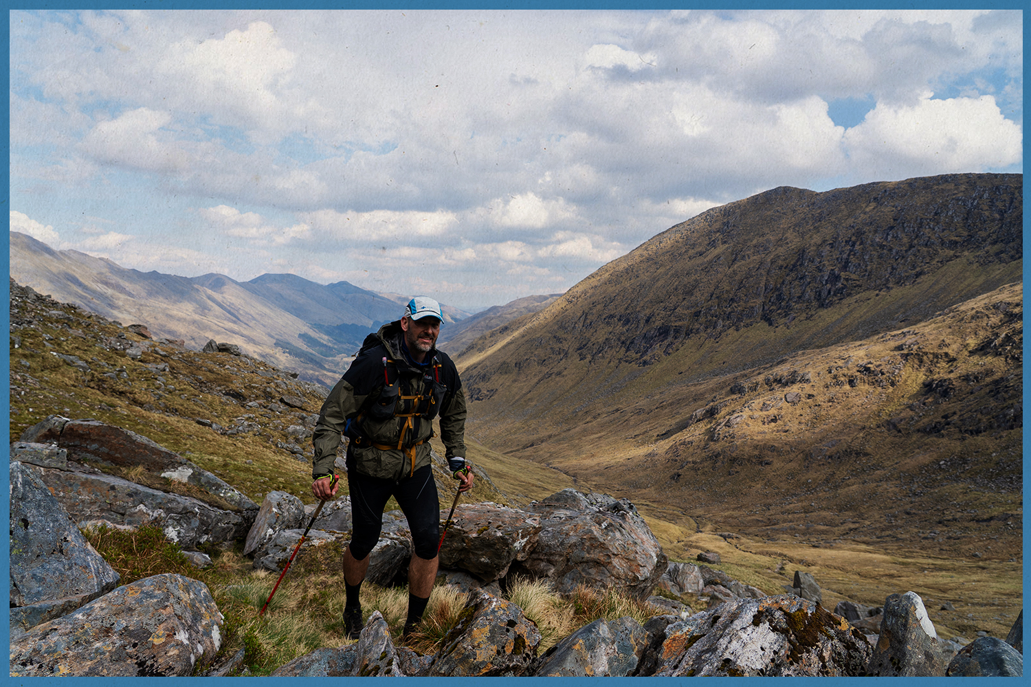 Runner climbs rocky highlands during the Highland Ultra.