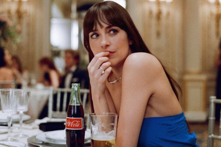 dakota johnson in a blue dress with a coke and beer from the materialists