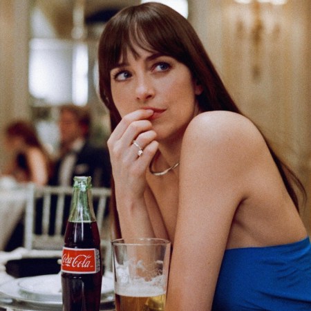 dakota johnson in a blue dress with a coke and beer from the materialists