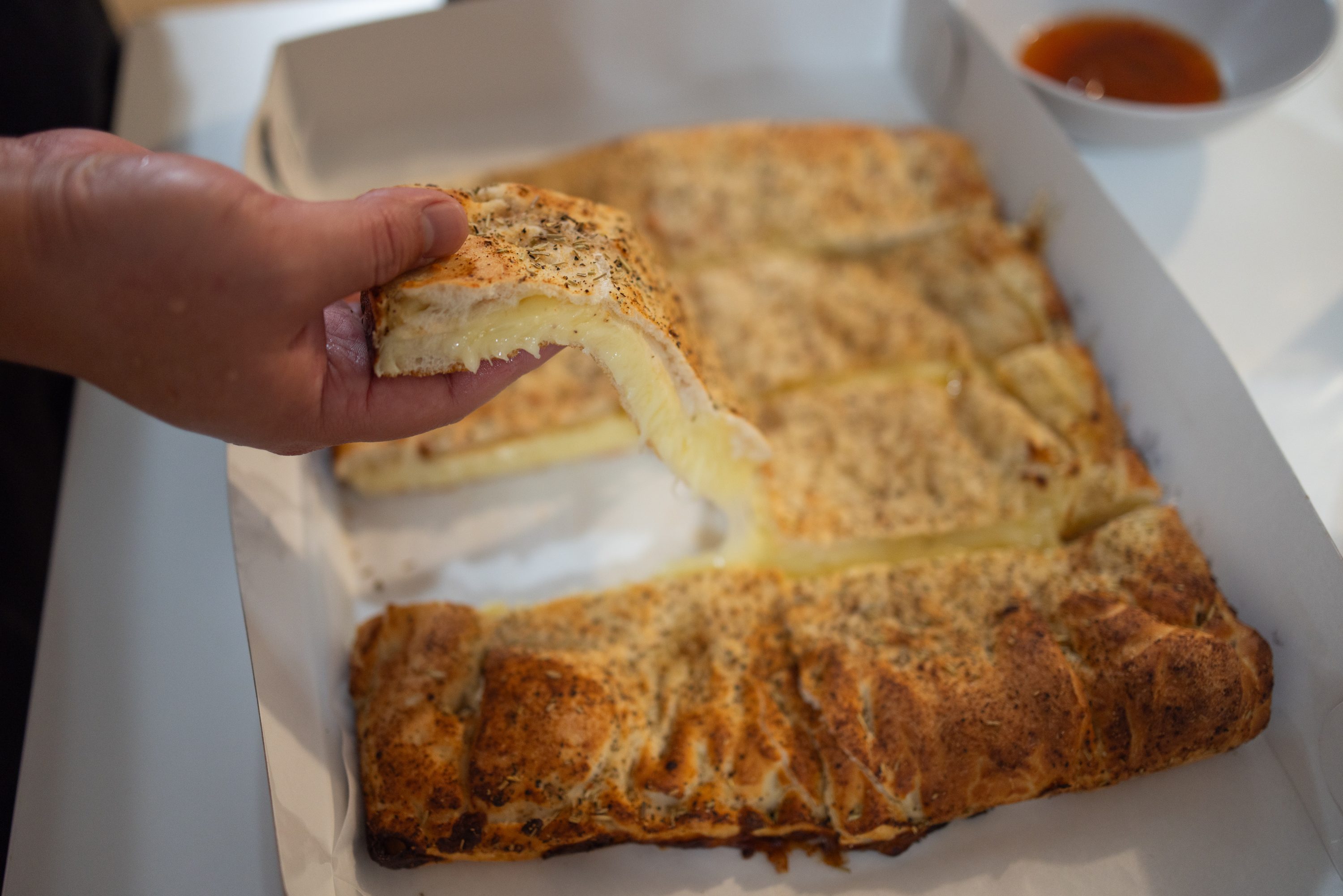 Old Forge-style Cheese Pizza in takeout box