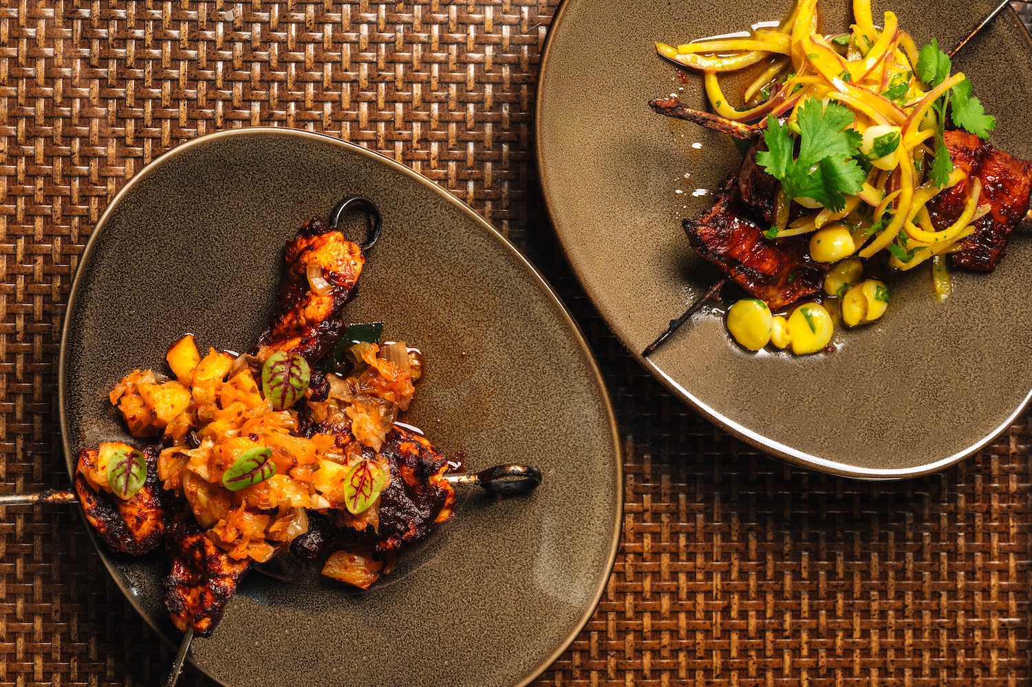 two grey bowls with korean bbq skewers and